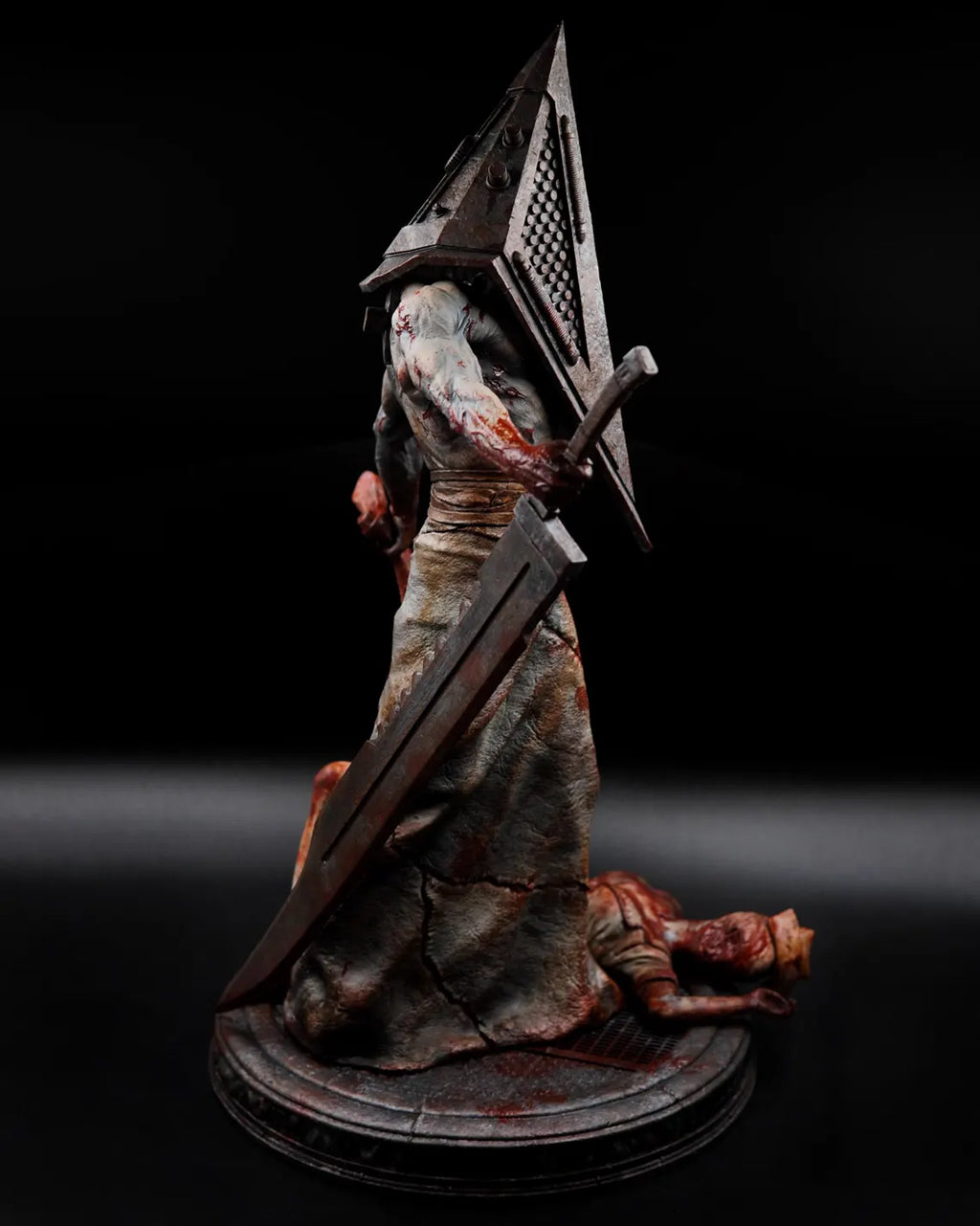 Estátua Colecionador - Cabeça de Pirâmide